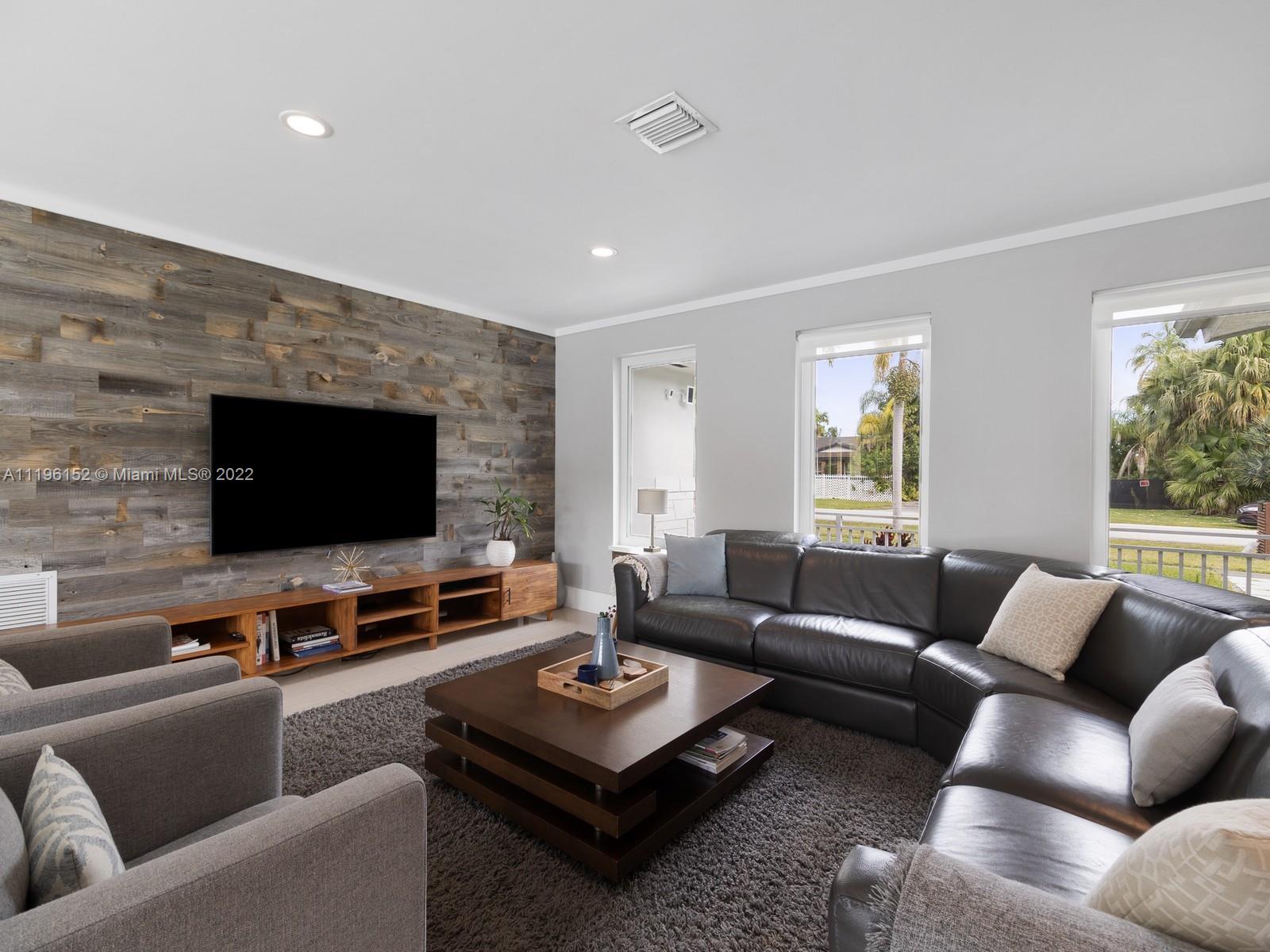 14250 Southwest 97th Avenue Miami, FL 33176 - Photo 9 of 38 a living room with furniture and a flat screen tv