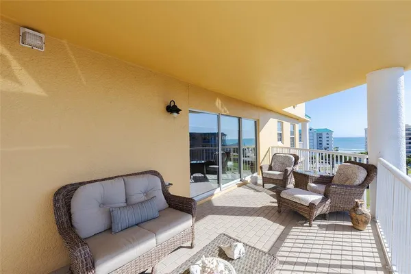 a balcony with furniture and city view