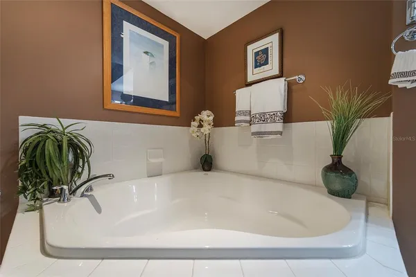 a bathroom with a bathtub and shower