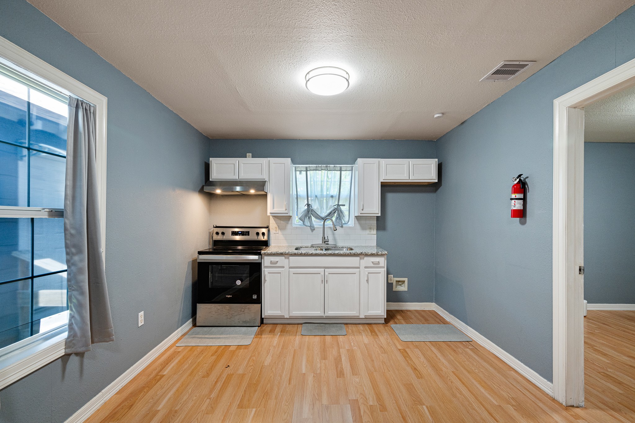 7815 Harding Street, Unit B Houston, TX 77012 - Photo 11 of 21 This inviting kitchen/dining combo boasts sleek cabinetry, modern appliances, and a cozy, open layout perfect for entertaining and family meals.