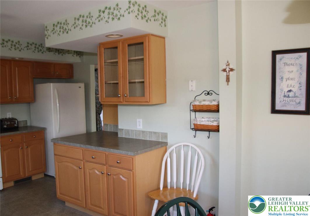712 Winterthur Way Easton, PA 18040 - Photo 11 of 20 a kitchen with stainless steel appliances granite countertop a sink microwave and cabinets
