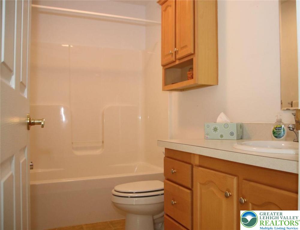 712 Winterthur Way Easton, PA 18040 - Photo 17 of 20 a bathroom with a sink a toilet and shower