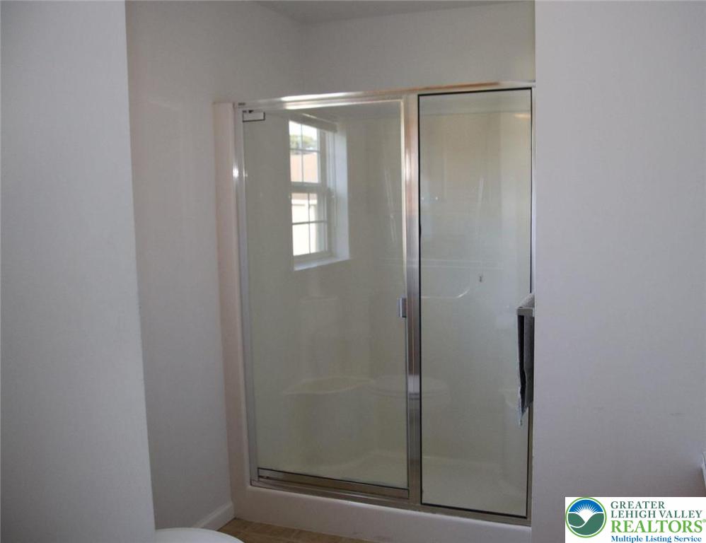 712 Winterthur Way Easton, PA 18040 - Photo 18 of 20 a bathroom with a glass shower door