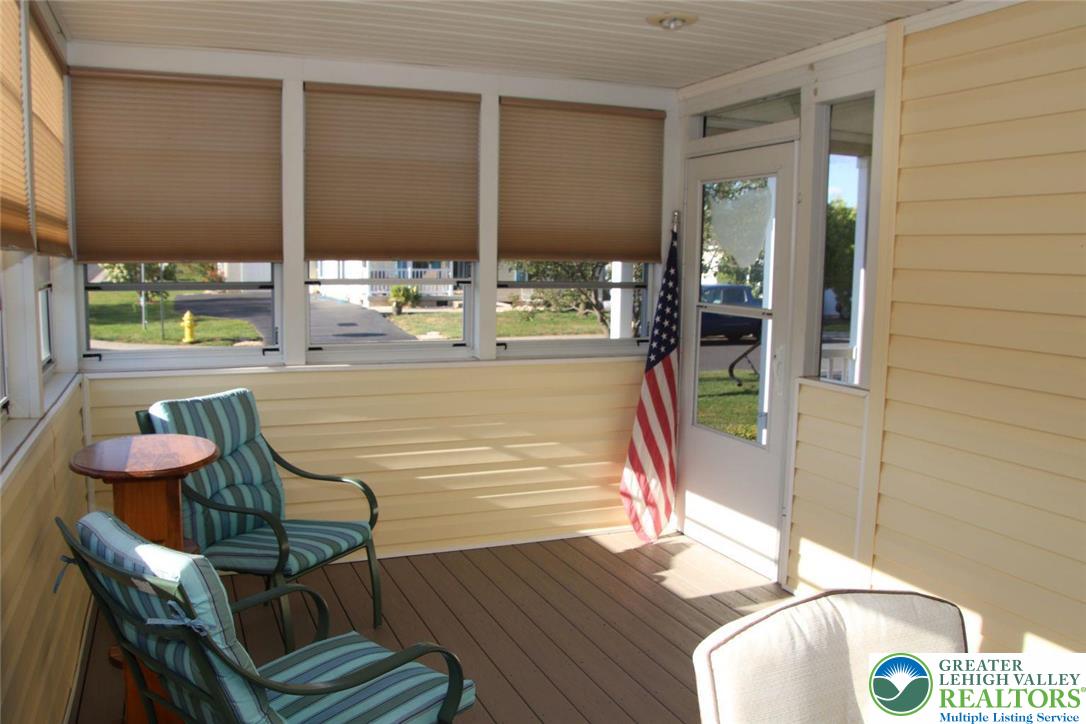 712 Winterthur Way Easton, PA 18040 - Photo 19 of 20 a view of a dining room with furniture a chandelier and wooden floor