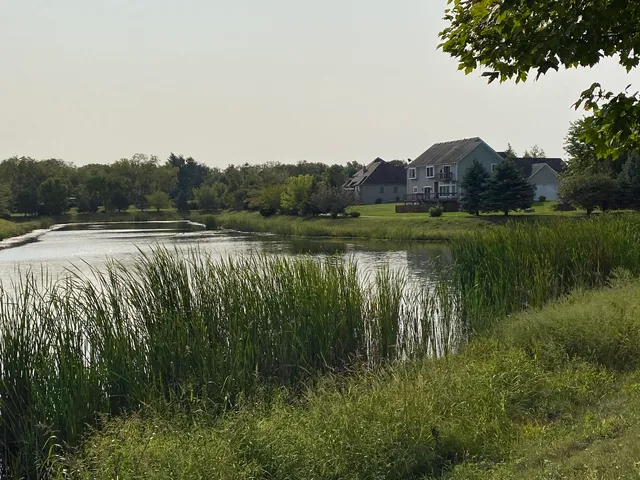 a view of lake with green space
