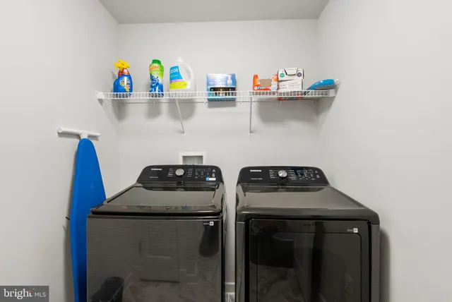 a kitchen with a stove and a refrigerator