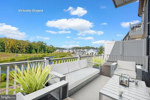 a view of roof deck with furniture
