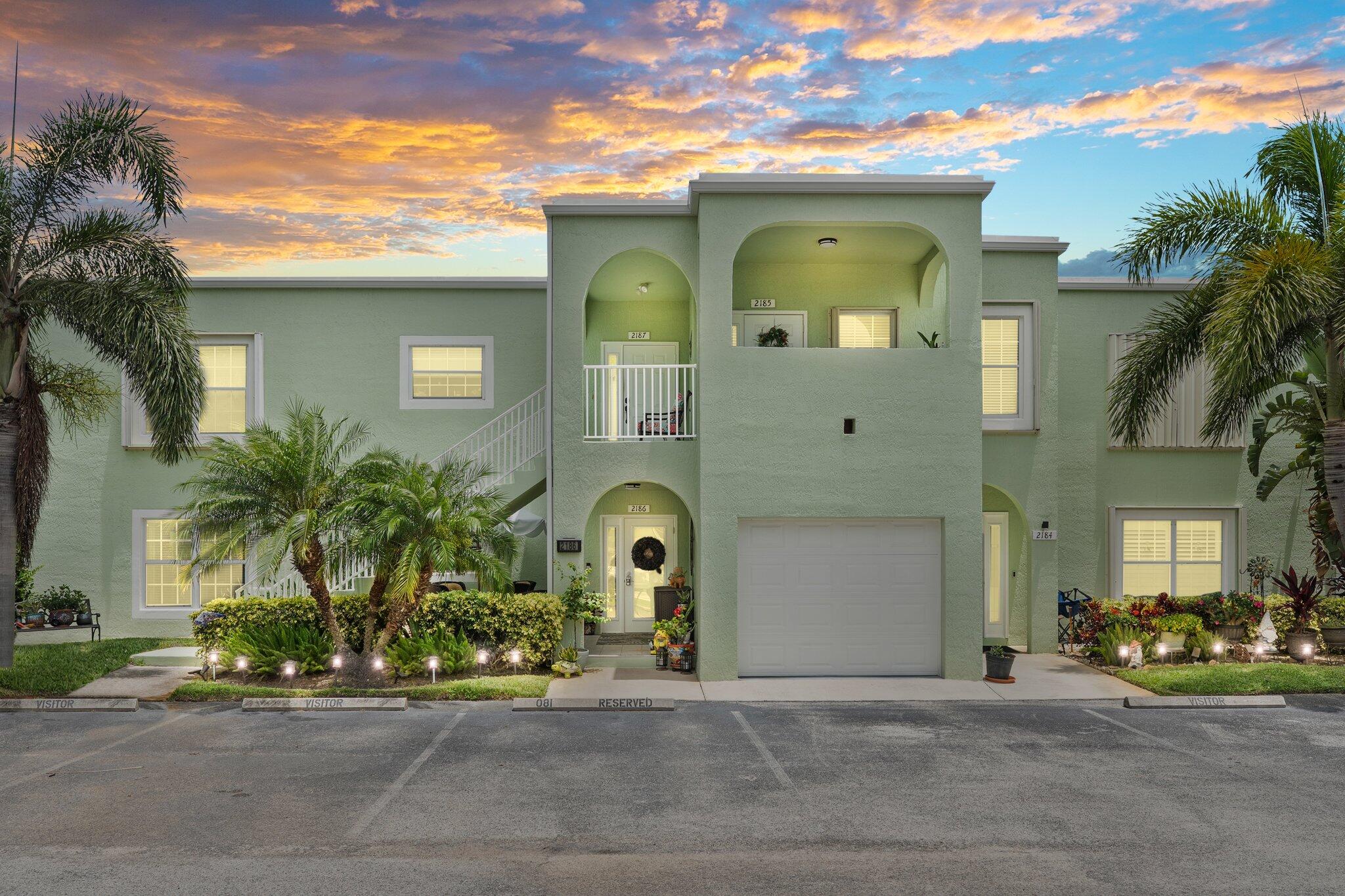 2186 Southeast Wild Meadow Circle Port St. Lucie, FL 34952 - Photo 1 of 57 a front view of a house with garden
