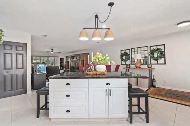 a living room with furniture gym equipment and a rug