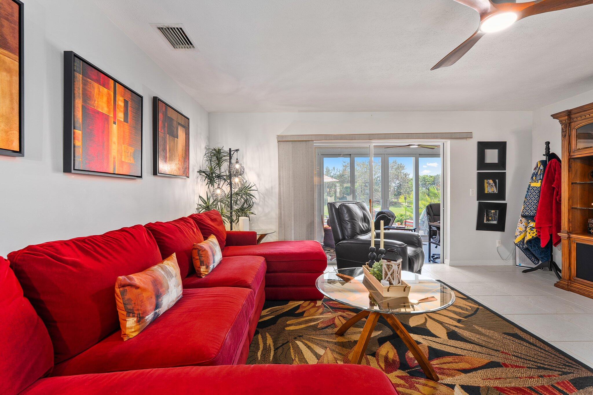 2186 Southeast Wild Meadow Circle Port St. Lucie, FL 34952 - Photo 17 of 57 a living room with furniture workspace and a window