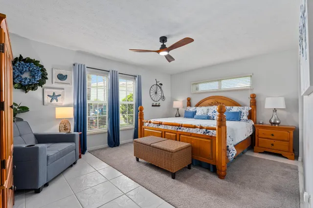a bathroom with double vanity sink and two mirror