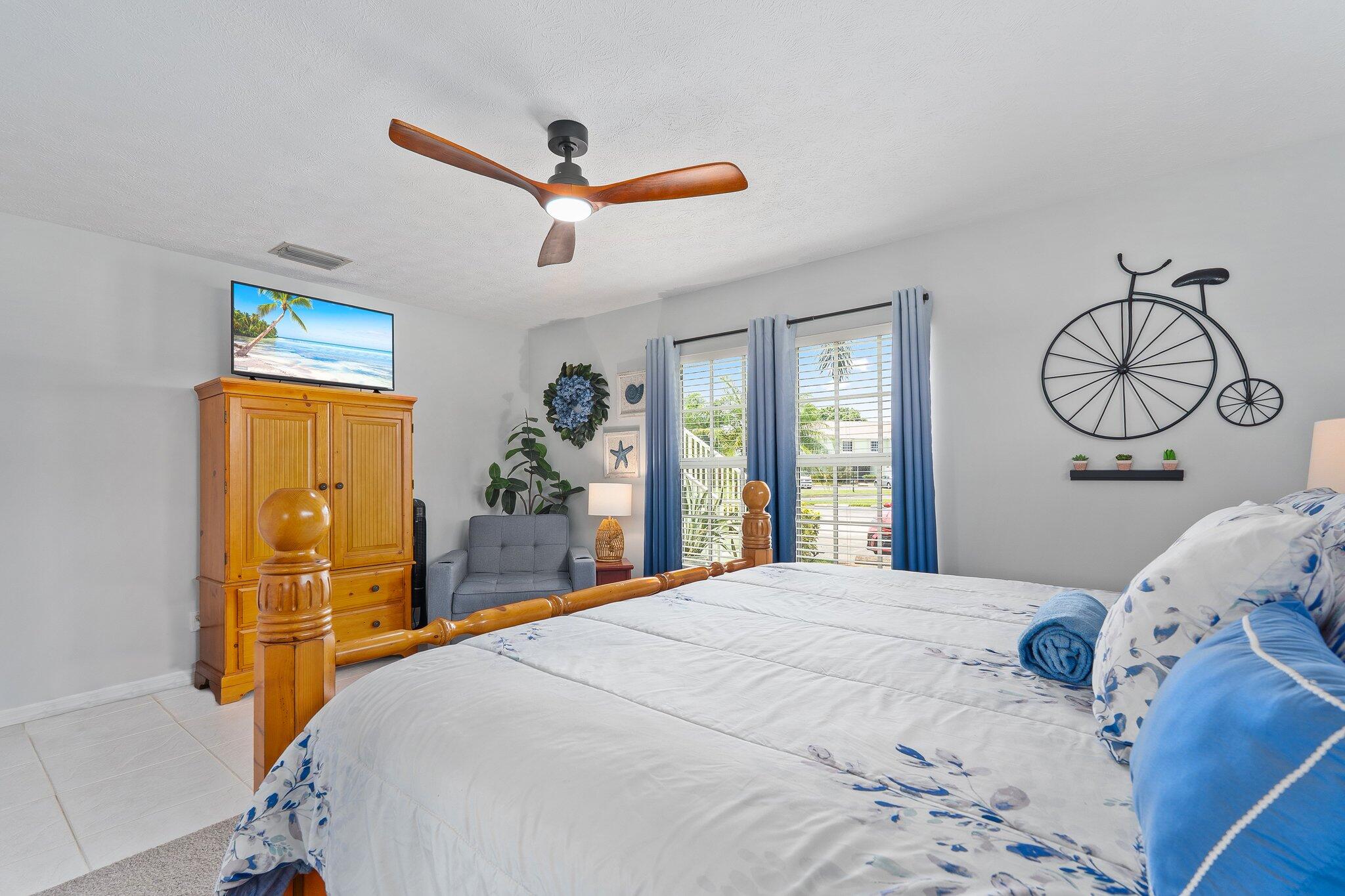 2186 Southeast Wild Meadow Circle Port St. Lucie, FL 34952 - Photo 27 of 57 a bedroom with a large bed and a window
