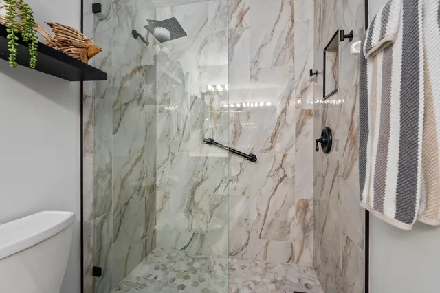 a bed room with a bed and a window