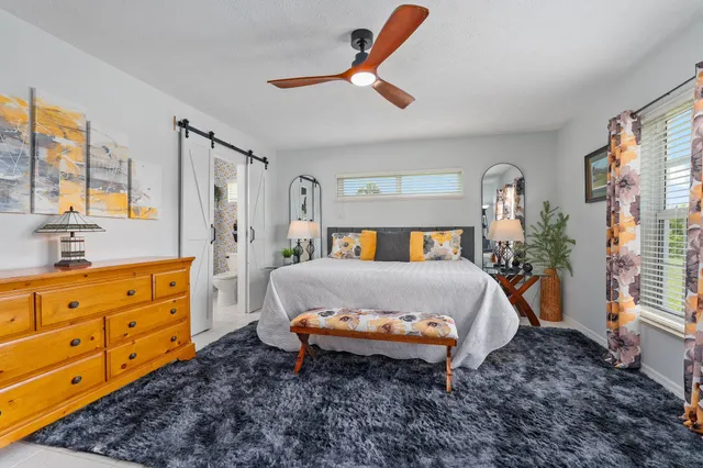 a bathroom with a sink a mirror and a shower curtain