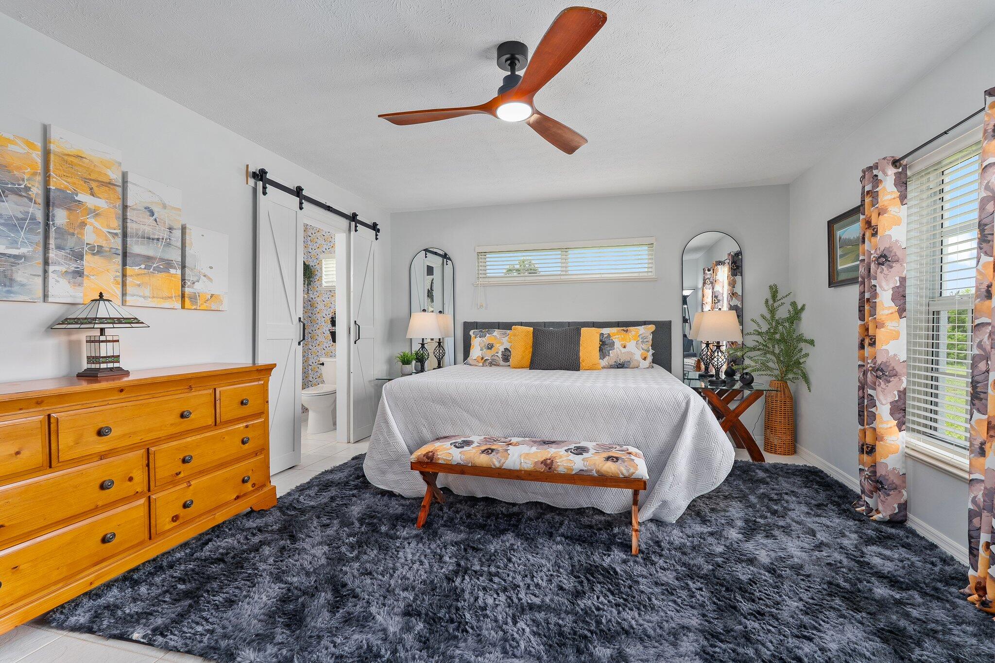 2186 Southeast Wild Meadow Circle Port St. Lucie, FL 34952 - Photo 32 of 57 a bed room with a bed and a window