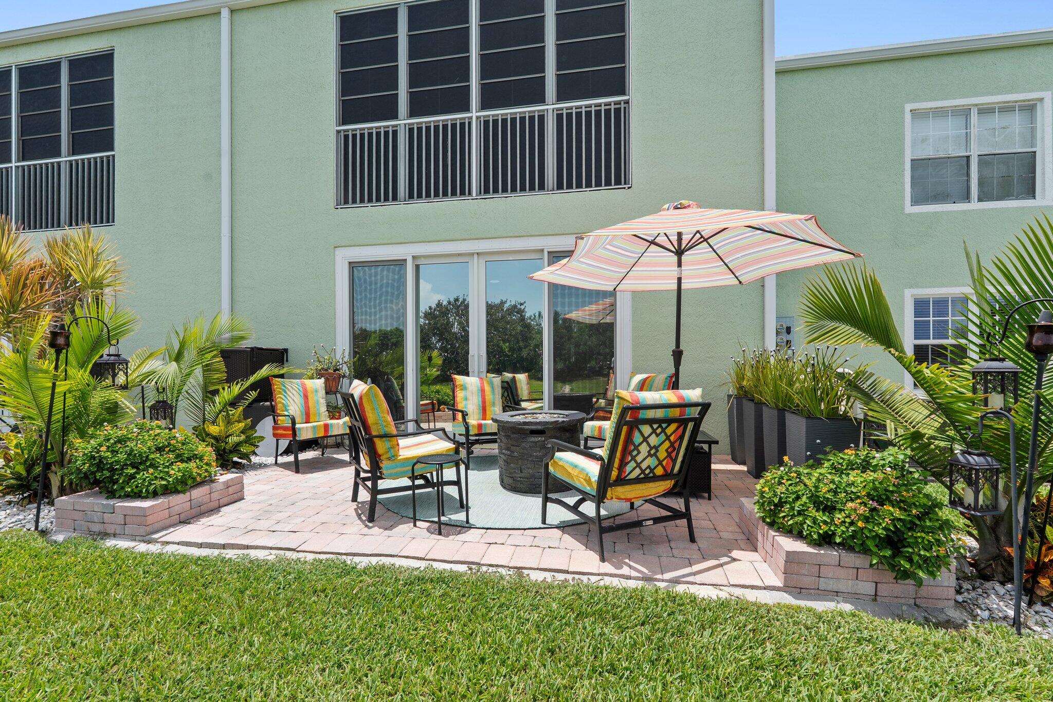 2186 Southeast Wild Meadow Circle Port St. Lucie, FL 34952 - Photo 43 of 57 a view of a backyard with sitting area and furniture