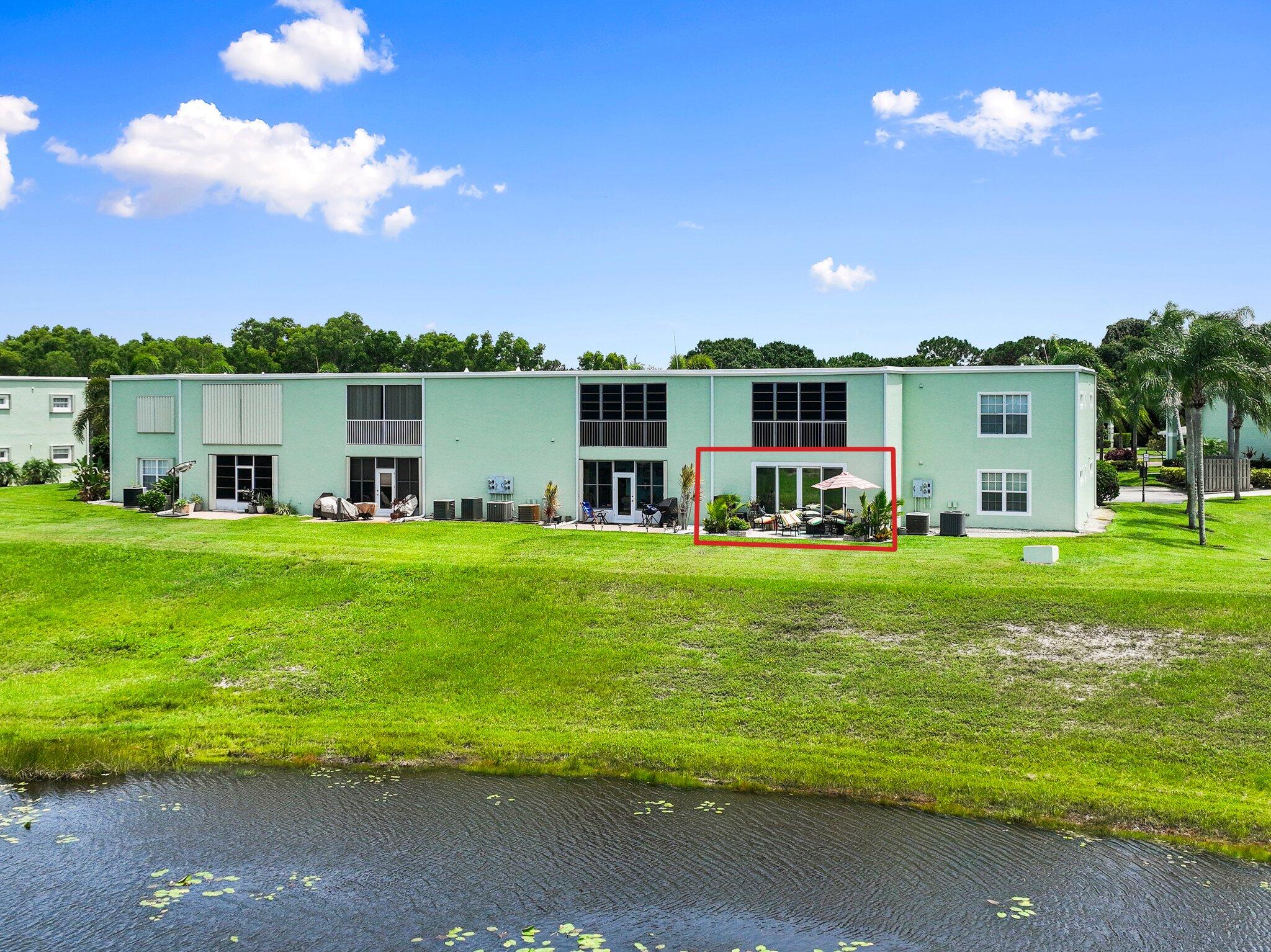 2186 Southeast Wild Meadow Circle Port St. Lucie, FL 34952 - Photo 46 of 57 a swimming pool that is in front of the house