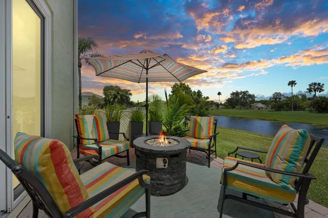 a view of a two chairs in the patio