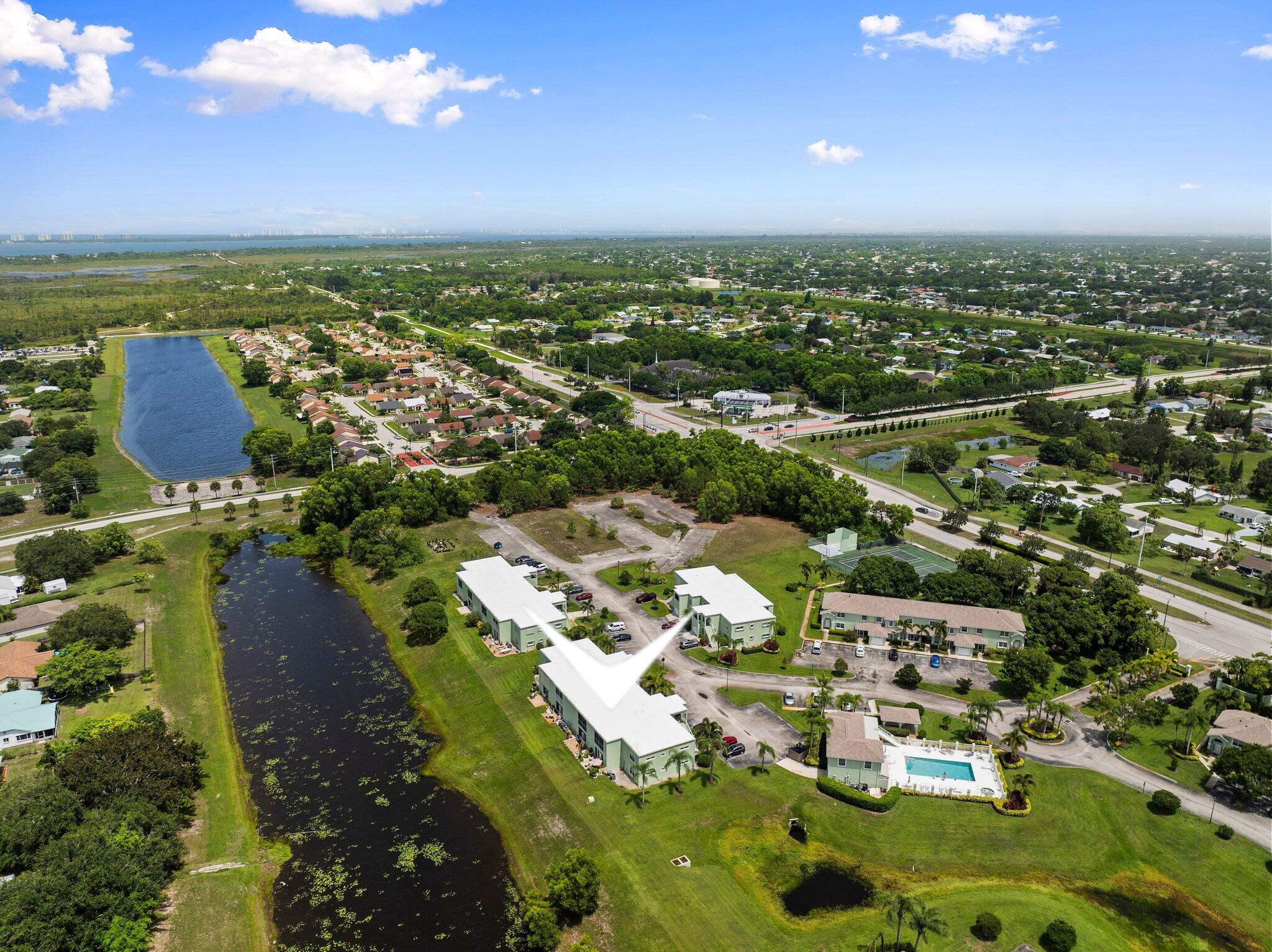 2186 Southeast Wild Meadow Circle Port St. Lucie, FL 34952 - Photo 51 of 57 an aerial view of residential houses with outdoor space