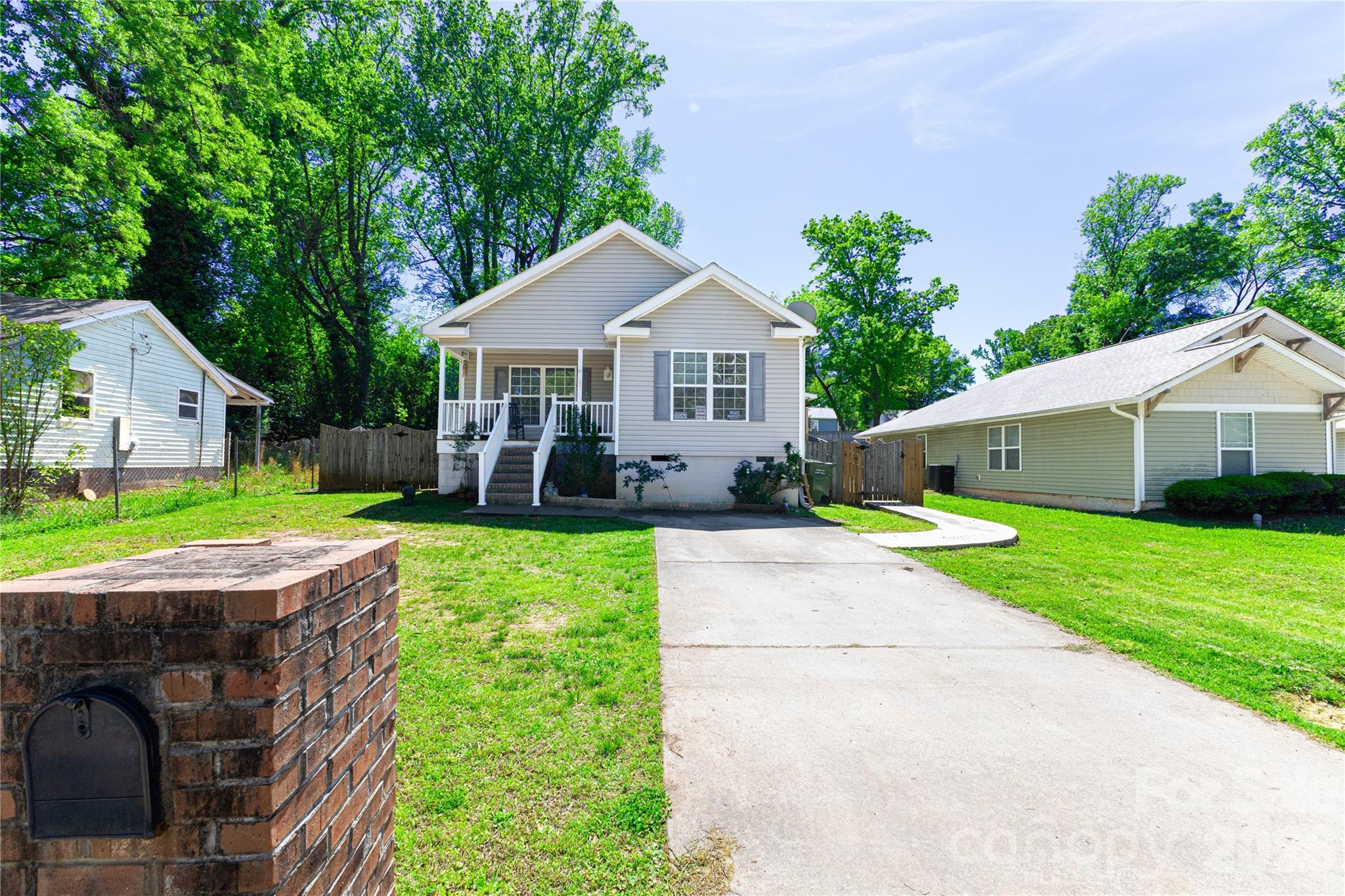 111 Berry Street Fort Mill, SC 29715 - Photo 2 of 19 a front view of house with a garden and patio