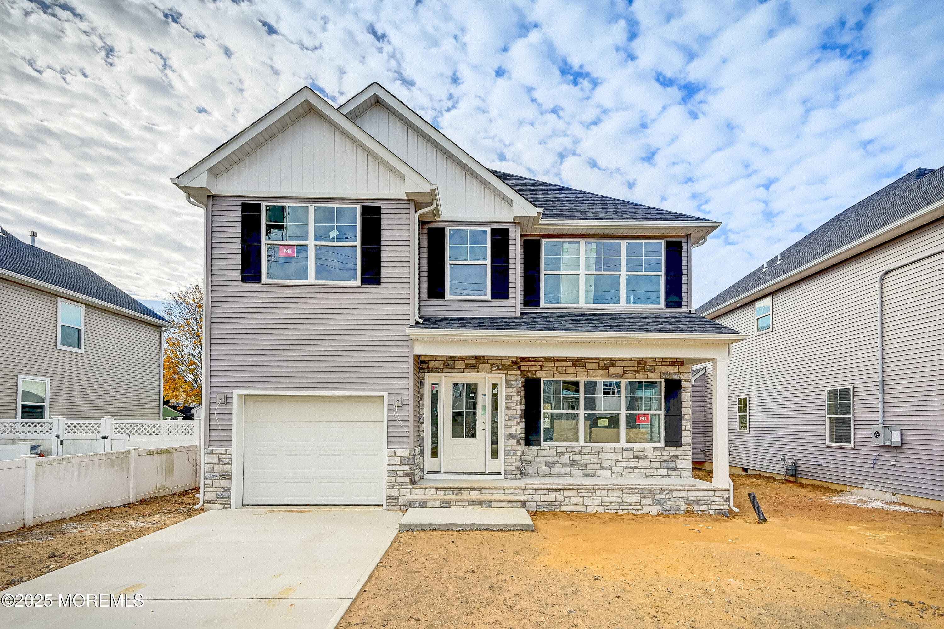 74 Manchester Avenue Keyport, NJ 07735 - Photo 11 of 14 a front view of a house with a garden