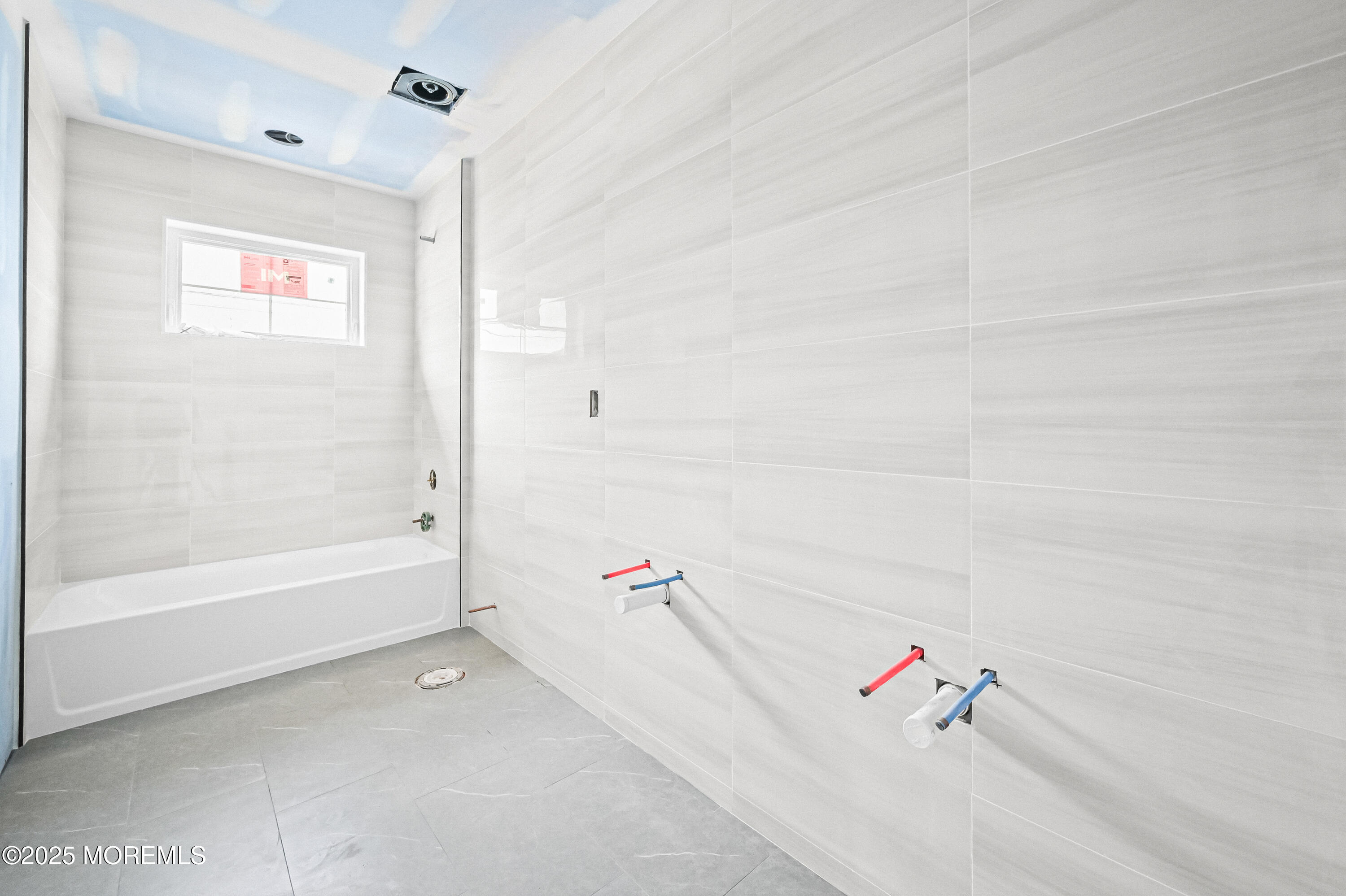 74 Manchester Avenue Keyport, NJ 07735 - Photo 2 of 14 a bathroom with a bathtub and a shower