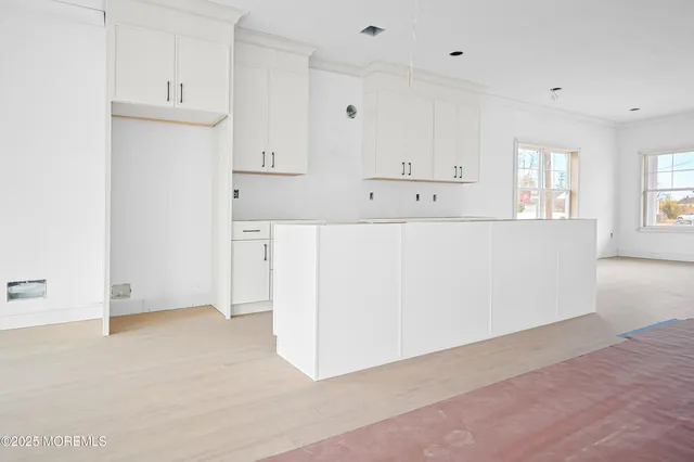 a view of kitchen with wooden floor
