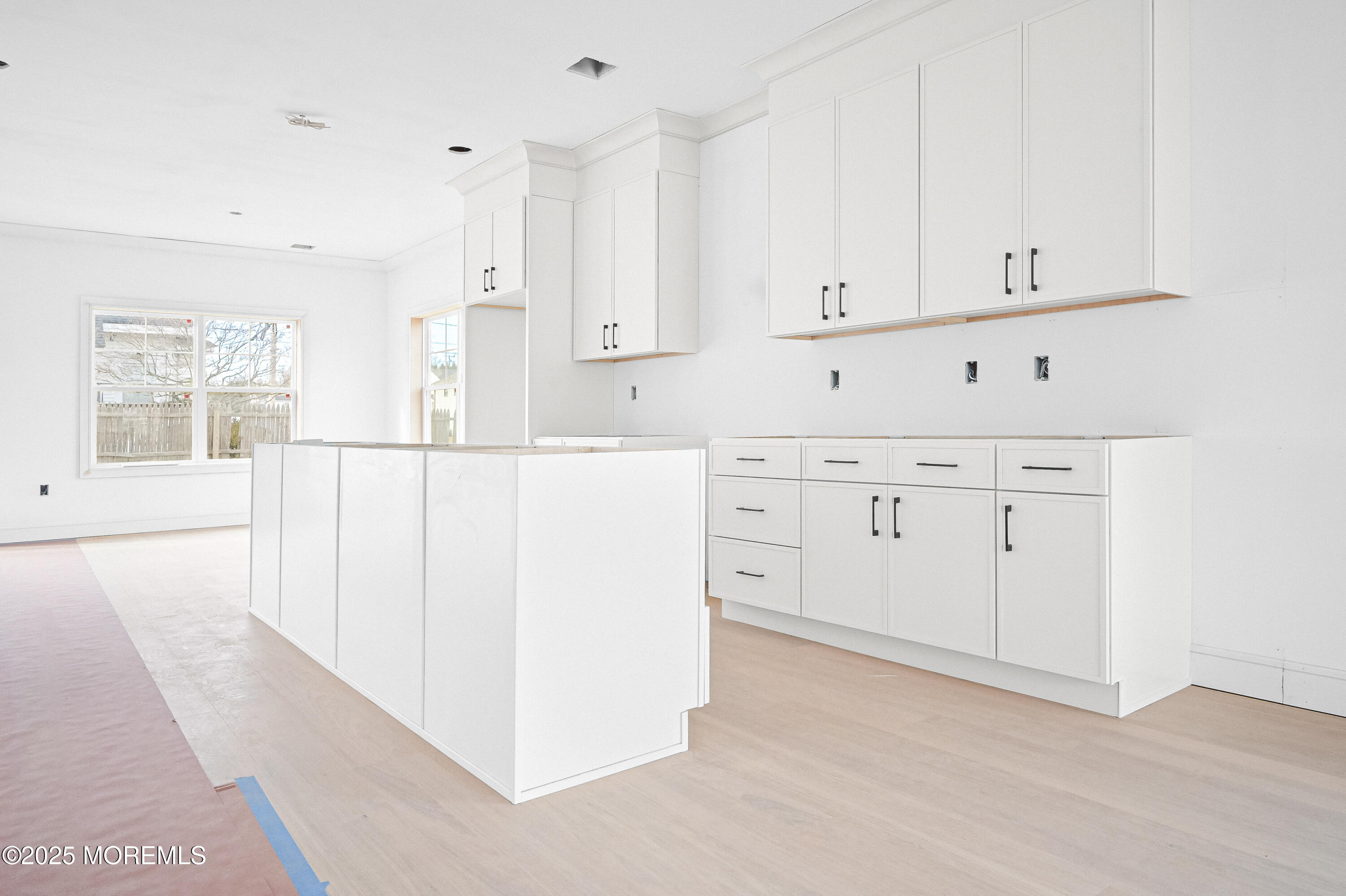 74 Manchester Avenue Keyport, NJ 07735 - Photo 10 of 14 a kitchen with white cabinets and window