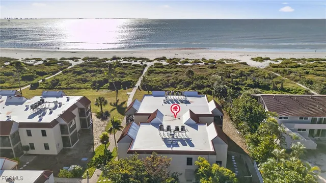 an aerial view of a city with ocean view