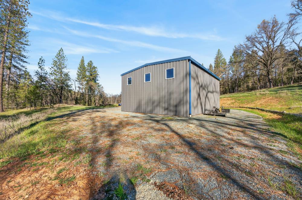 3150 Bridgeport School Road Fiddletown, CA 95629 - Photo 11 of 48 a view of a house with backyard and trees