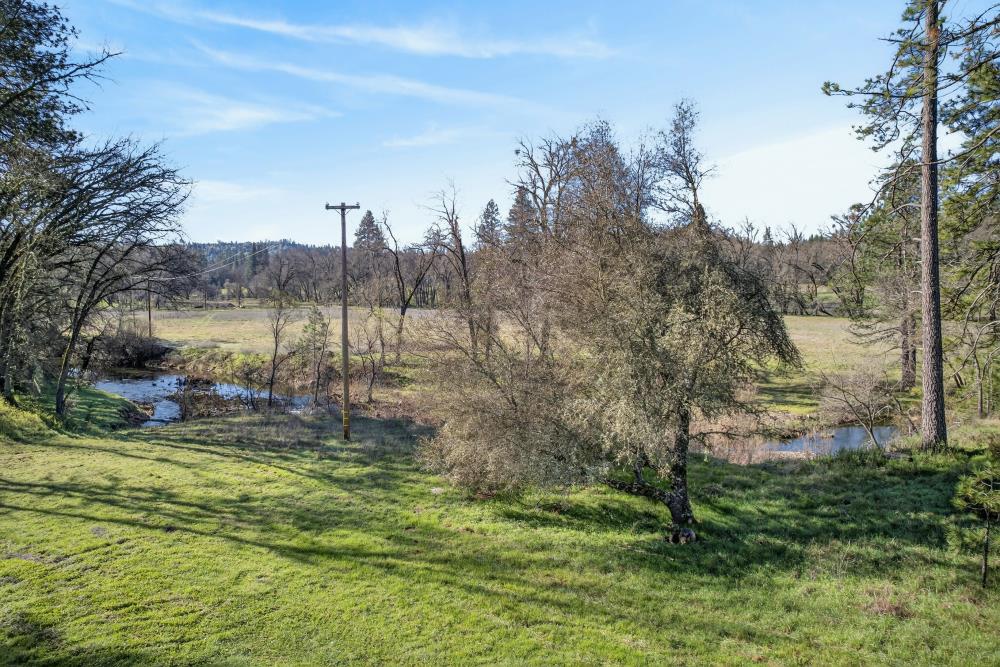 3150 Bridgeport School Road Fiddletown, CA 95629 - Photo 43 of 48 a view of a lake with a mountain in the background