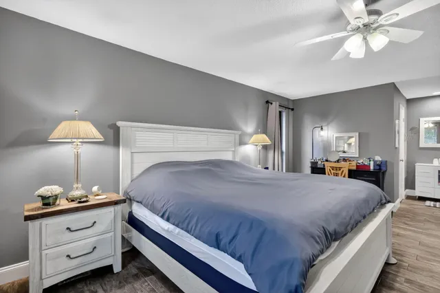 a bedroom with a bed and a lamp