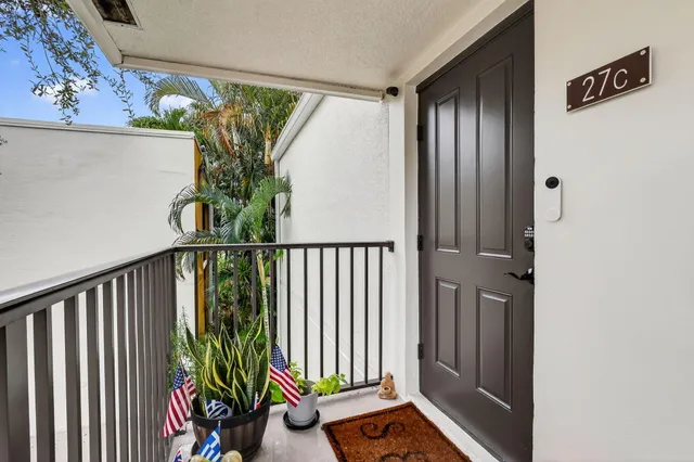 a view of a backyard with a patio table and chairs