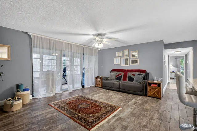 a living room with furniture and a rug