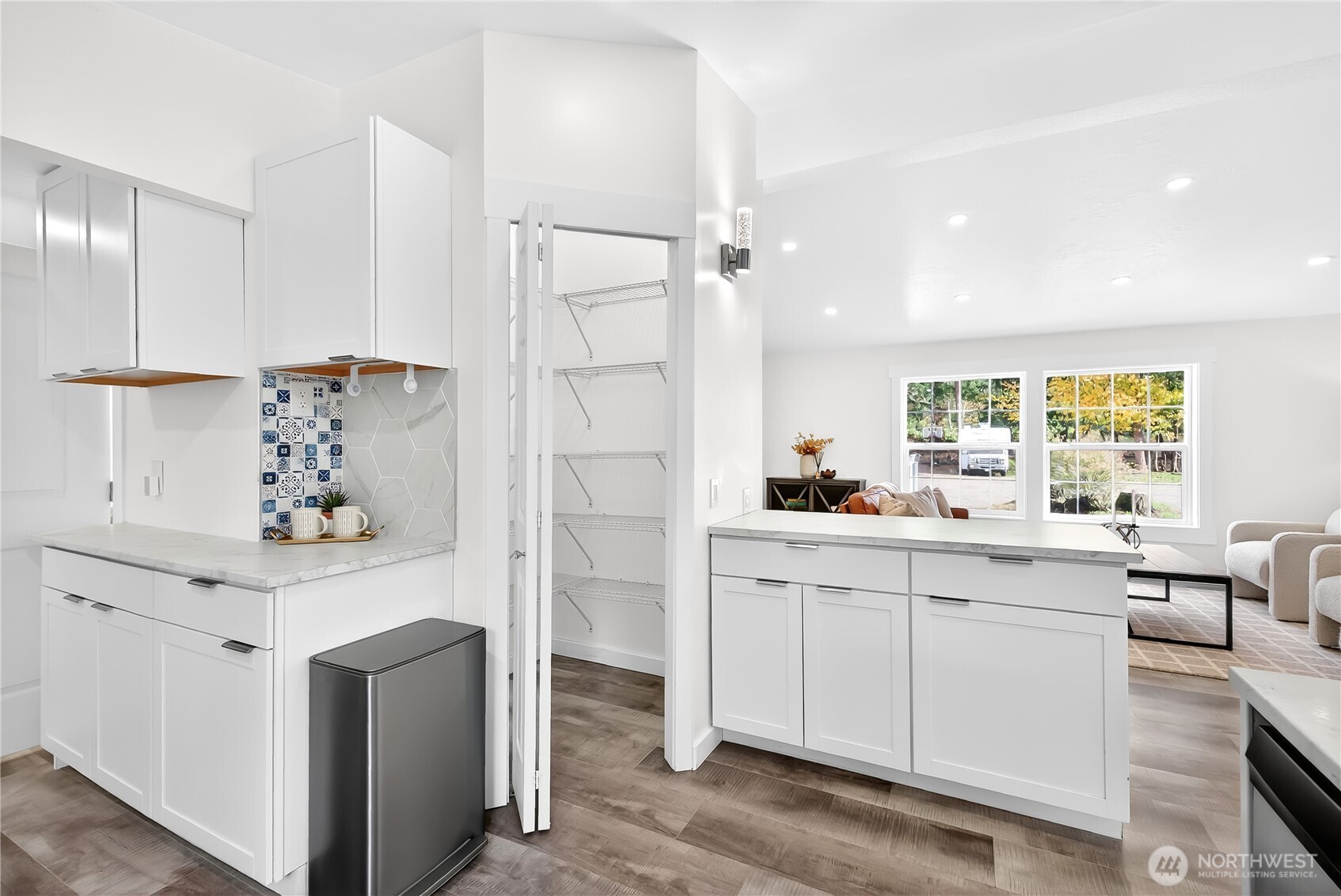 6583 Goodwin Road Everson, WA 98247 - Photo 11 of 40 a kitchen with white cabinets and sink