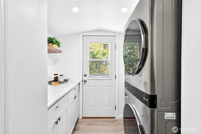 a utility room with window washer and dryer