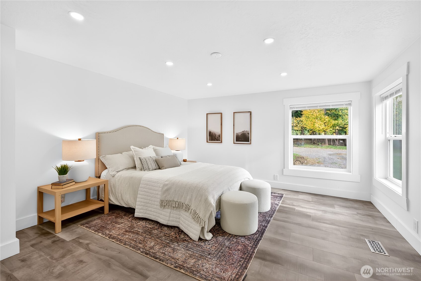 6583 Goodwin Road Everson, WA 98247 - Photo 16 of 40 a bedroom with a bed and wooden floor