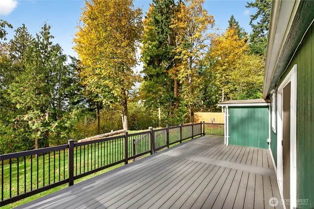 a view of a balcony with wooden floor