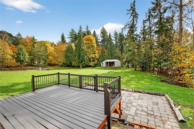 a view of a table and chairs on the roof deck
