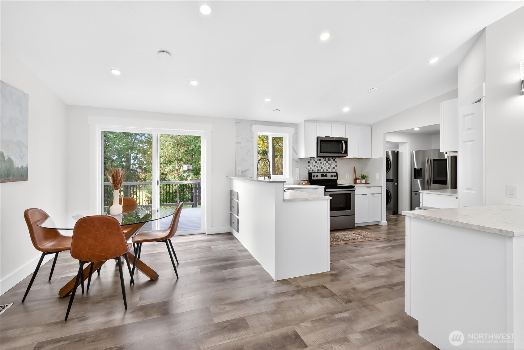 6583 Goodwin Road Everson, WA 98247 - Photo 8 of 40 a living room kitchen with furniture and a wooden floor