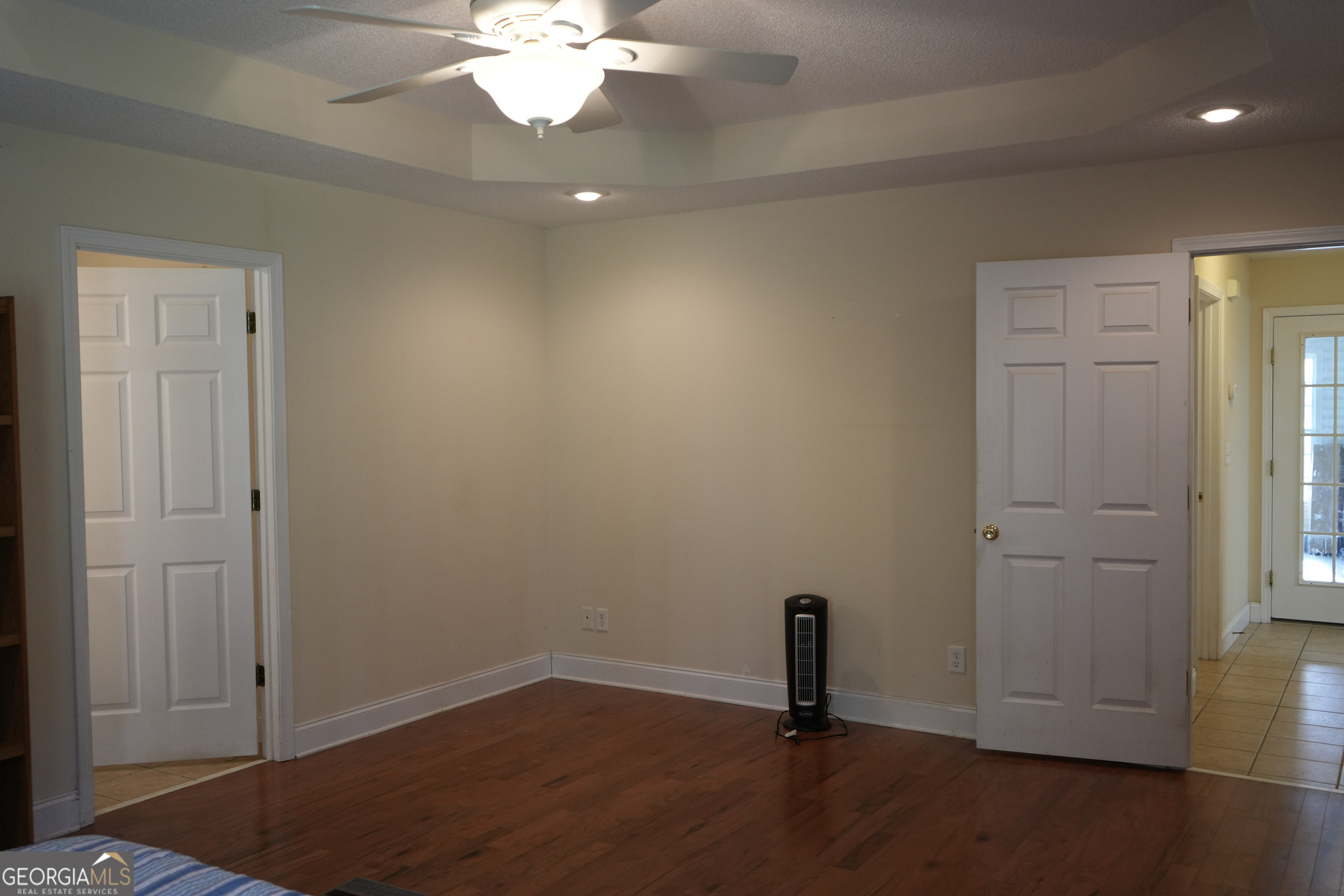 1293 Payne Road Rentz, GA 31075 - Photo 14 of 40 an empty room with wooden floor closet and windows