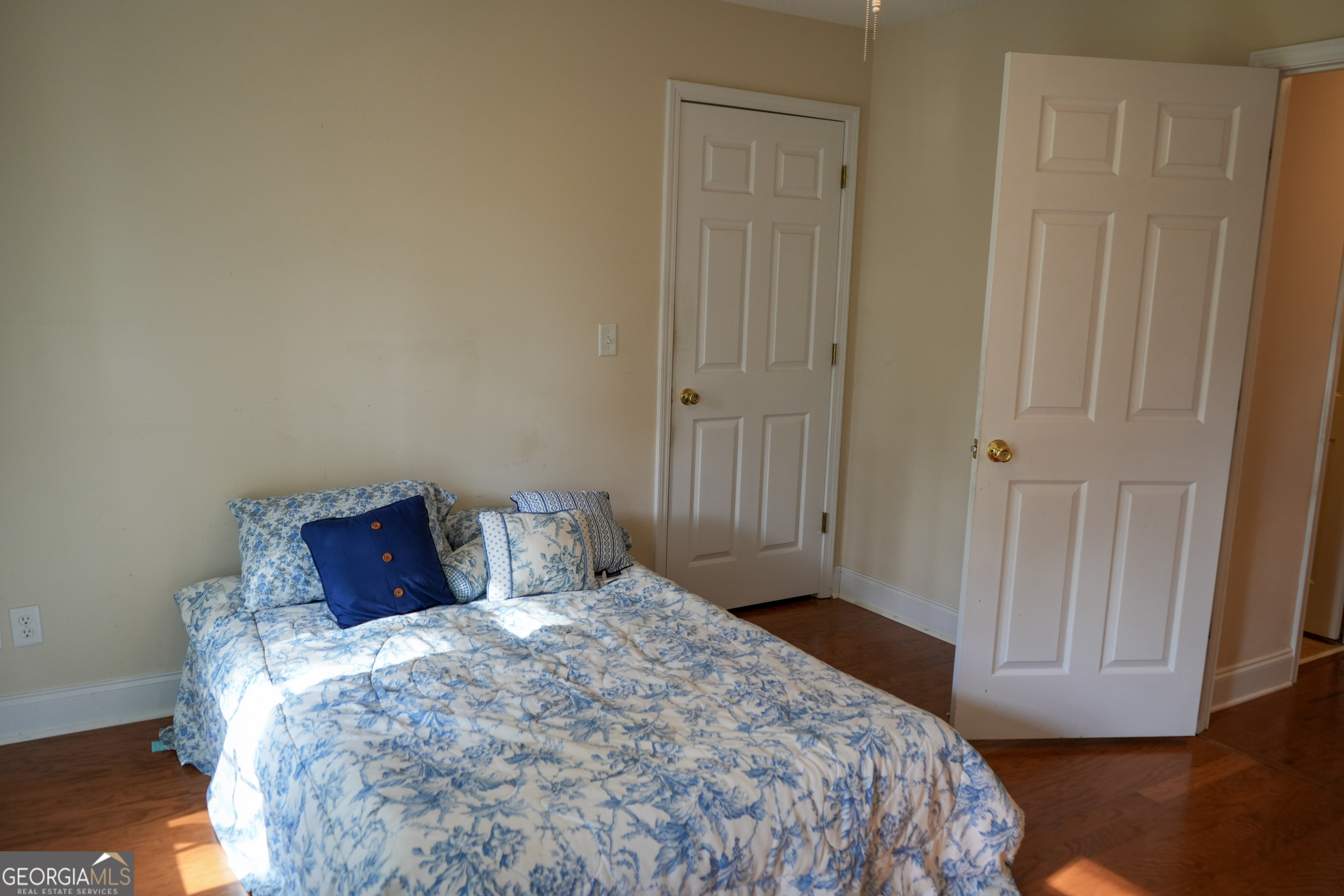 1293 Payne Road Rentz, GA 31075 - Photo 19 of 40 a bedroom with a bed and wooden floor