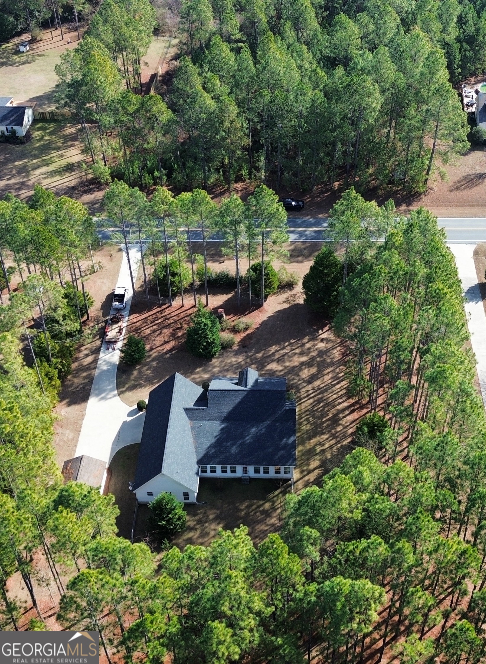 1293 Payne Road Rentz, GA 31075 - Photo 38 of 40 an aerial view of a house with a yard and large trees