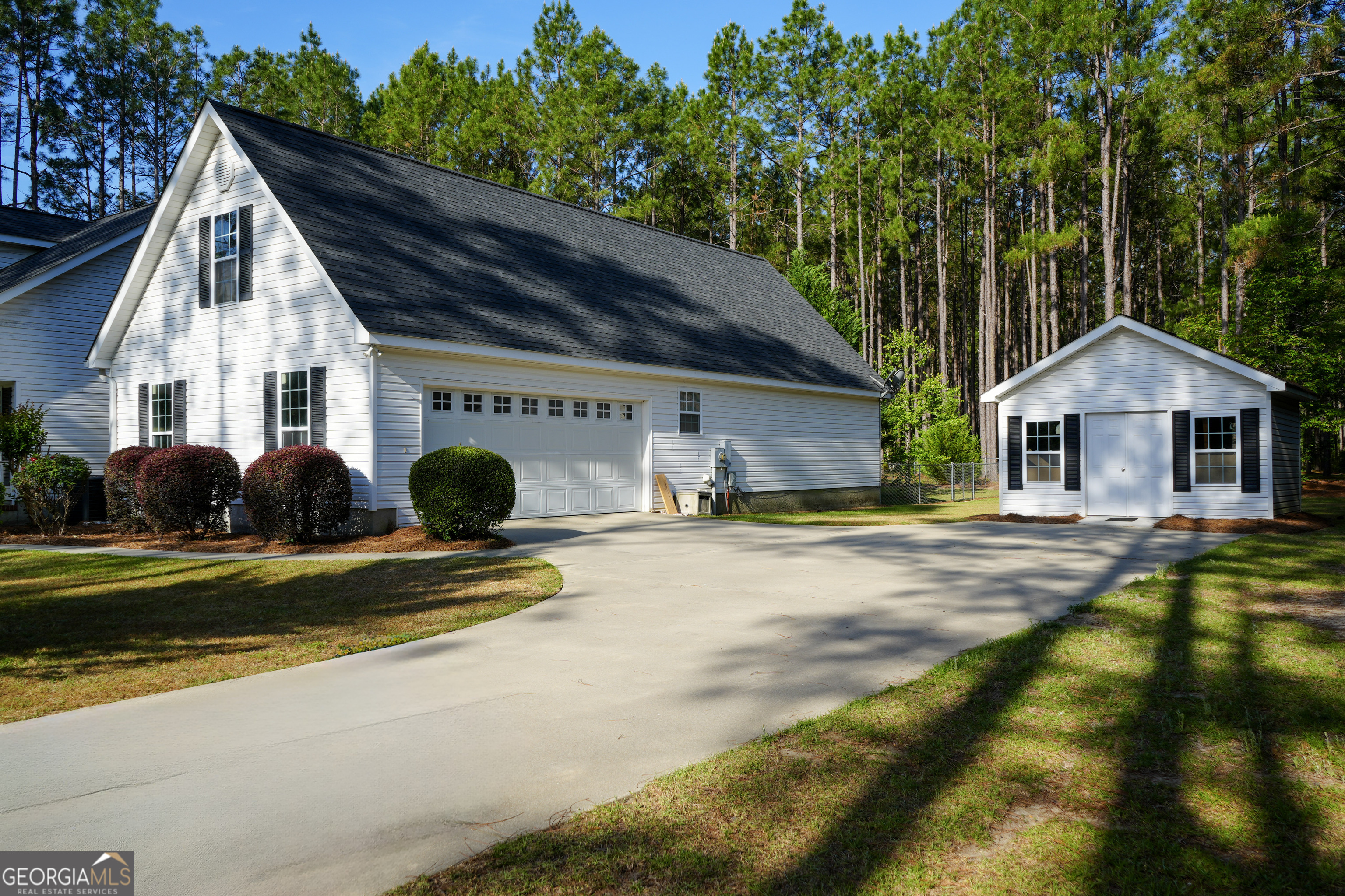 1293 Payne Road Rentz, GA 31075 - Photo 4 of 40 a view of house with garden and tall trees