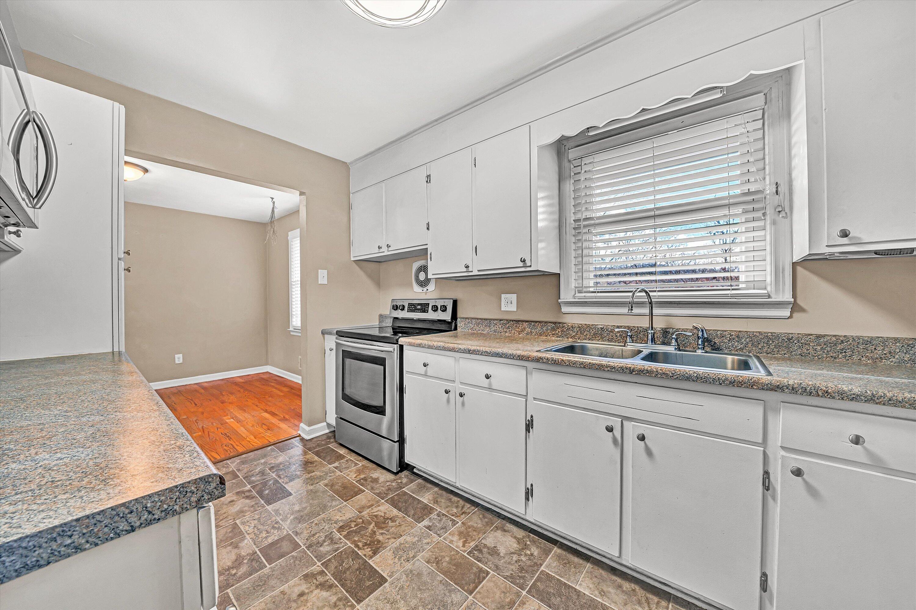519 Doyle Street Salem, VA 24153 - Photo 12 of 40 a kitchen with stainless steel appliances granite countertop a sink stove and cabinets