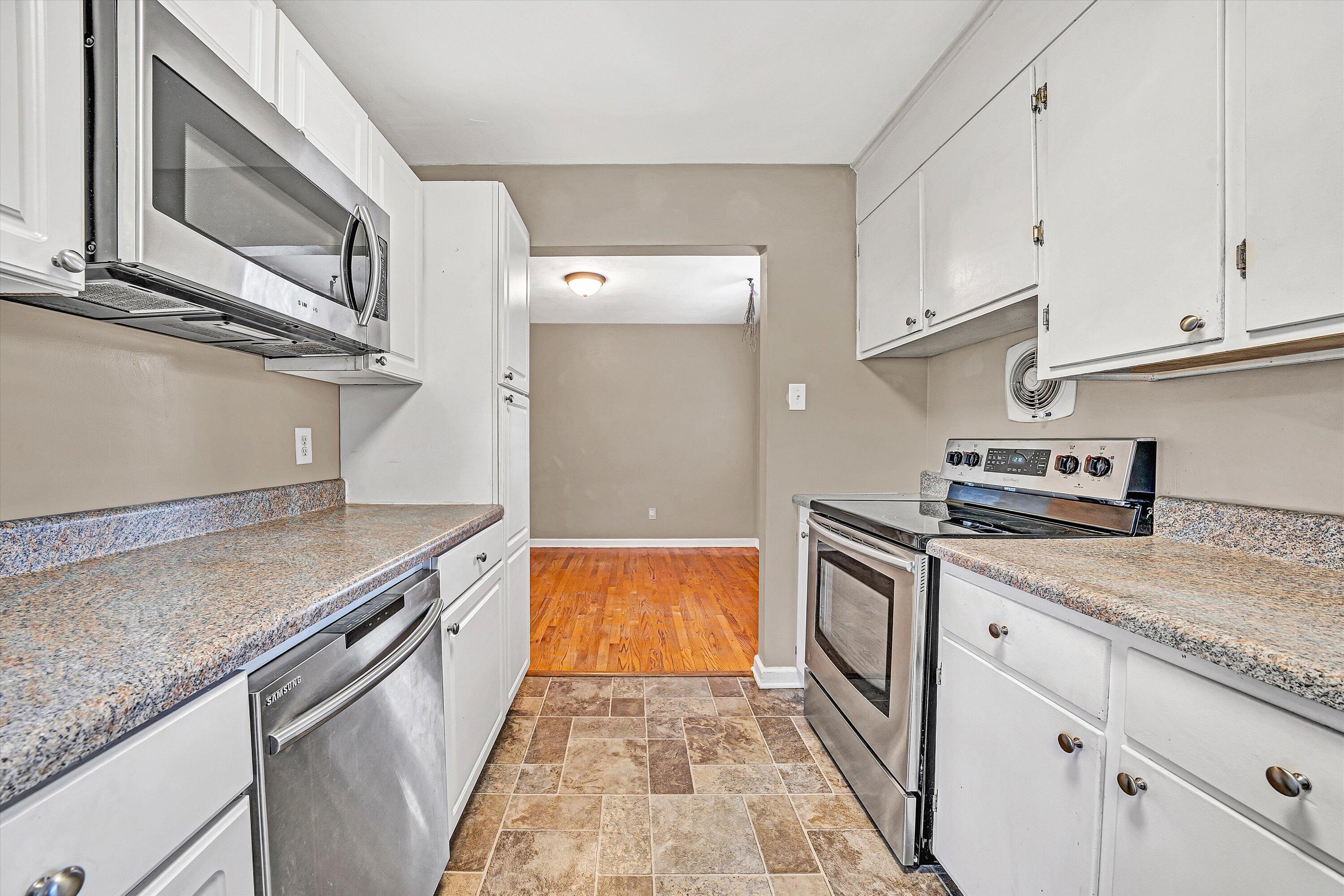 519 Doyle Street Salem, VA 24153 - Photo 13 of 40 a kitchen with granite countertop cabinets stainless steel appliances and a counter space