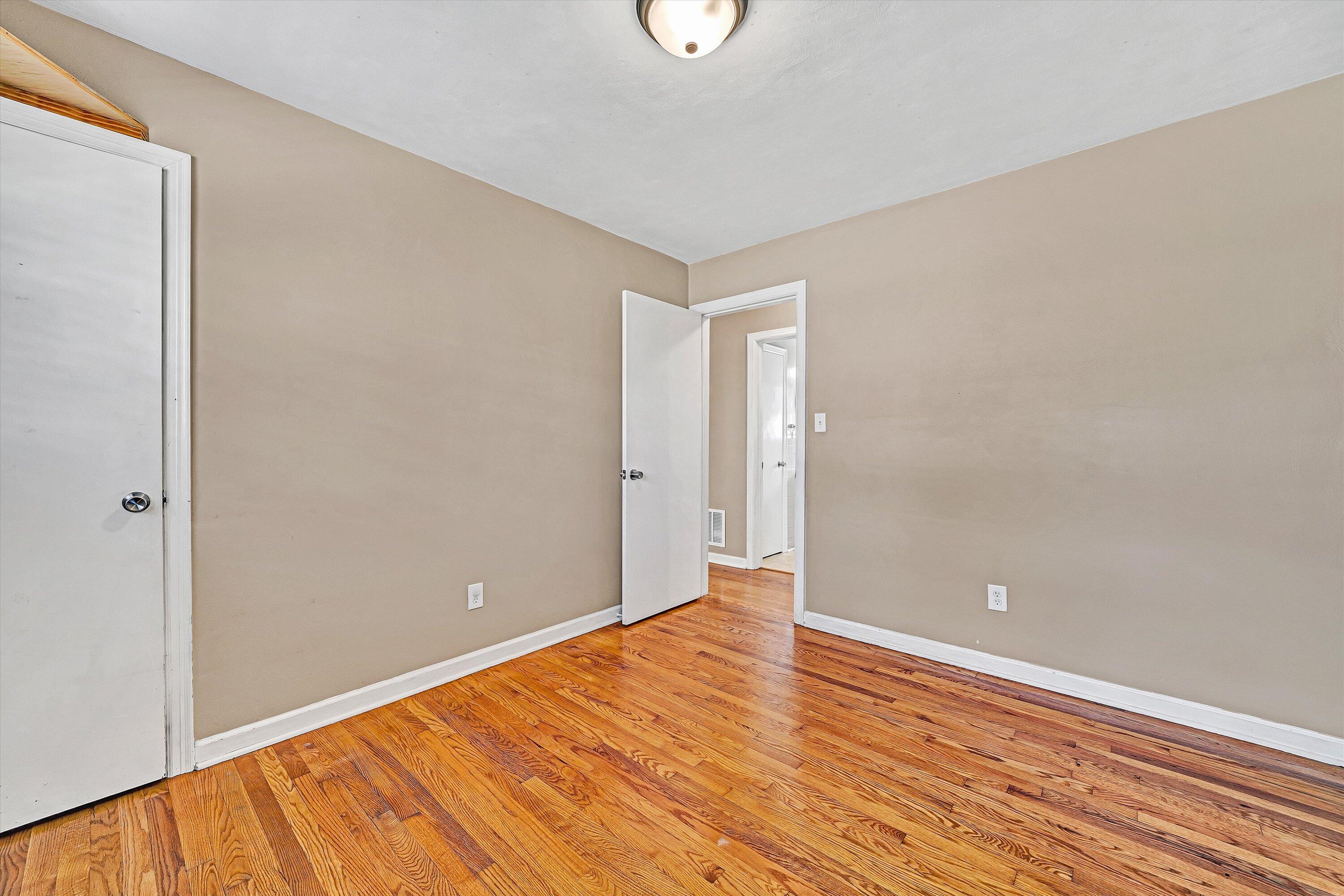 519 Doyle Street Salem, VA 24153 - Photo 16 of 40 a view of an empty room with wooden floor