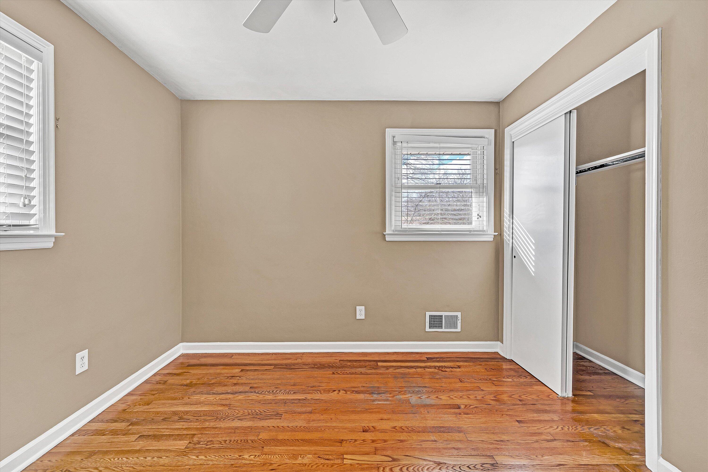 519 Doyle Street Salem, VA 24153 - Photo 19 of 40 a view of an empty room with wooden floor and a window