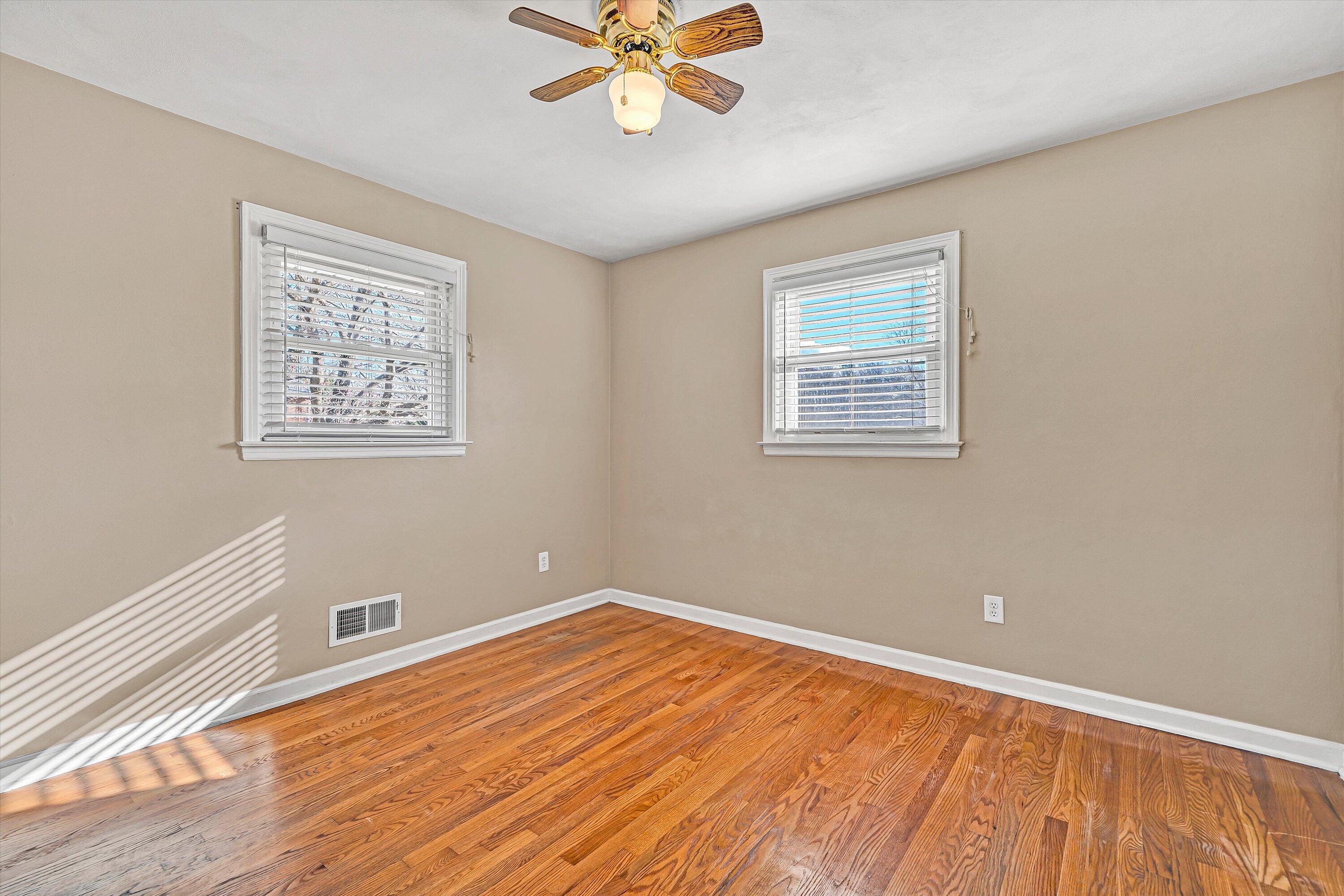 519 Doyle Street Salem, VA 24153 - Photo 20 of 40 a view of an empty room with wooden floor and a window