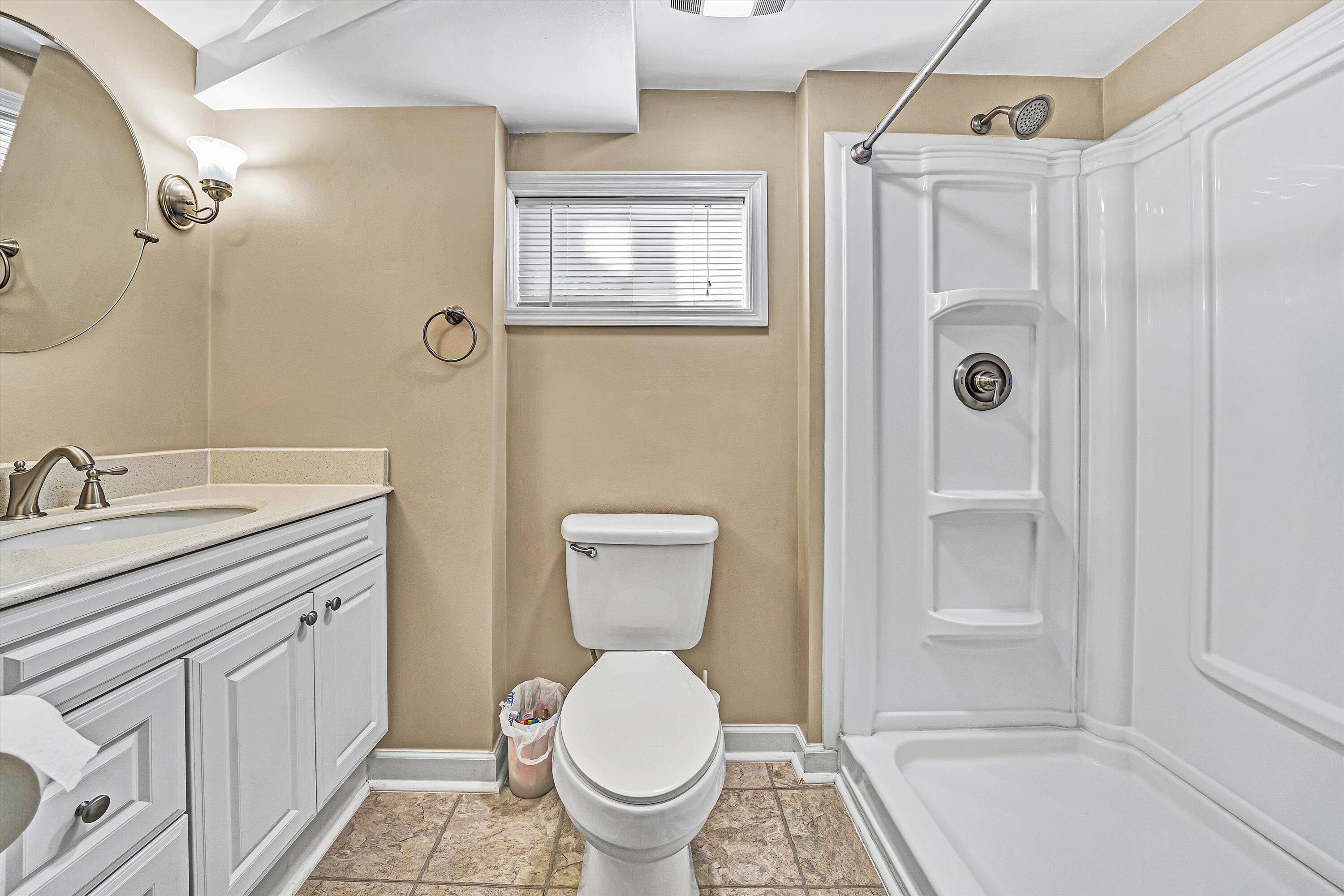 519 Doyle Street Salem, VA 24153 - Photo 32 of 40 a bathroom with a granite countertop toilet sink and mirror